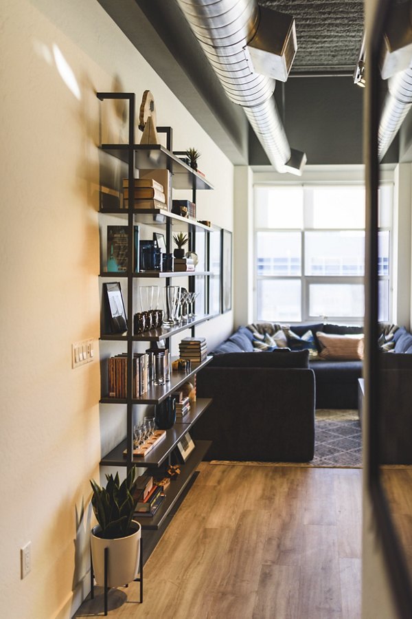 Stylish kitchen featuring granite countertops and stainless steel appliances in The Lofts at Westgate Apartments