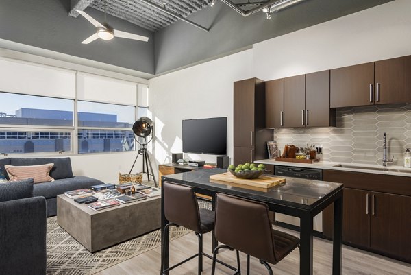 Spacious open-concept kitchen with modern appliances in The Lofts at Westgate Apartments