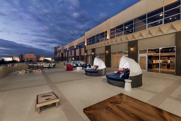Rooftop deck with cozy seating and skyline views at The Lofts at Westgate Apartments