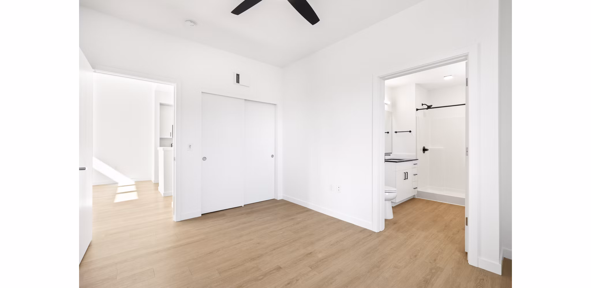 Elegant bedroom with modern furniture at Hudson West Apartments, a luxurious Greystar property in an upscale neighborhood