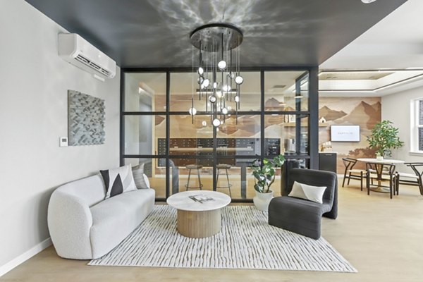 Luxurious clubhouse with modern design at Hudson West Apartments, perfect for social gatherings and relaxation in a vibrant community setting