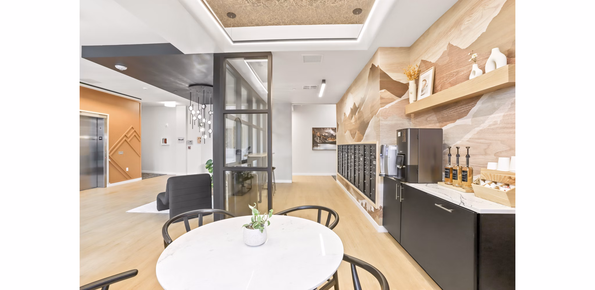 Clubhouse featuring modern design and comfortable seating at Hudson West Apartments