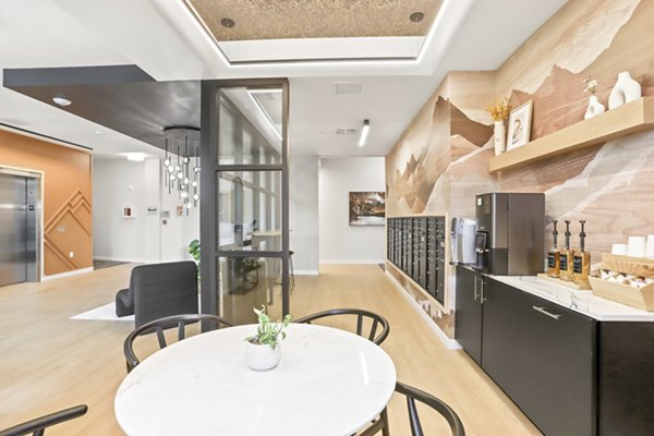 Clubhouse featuring modern design and comfortable seating at Hudson West Apartments