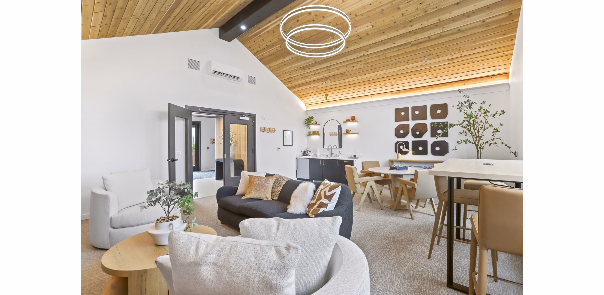 Elegant clubhouse with modern furnishings at Hudson West Apartments, ideal for social gatherings and community events
