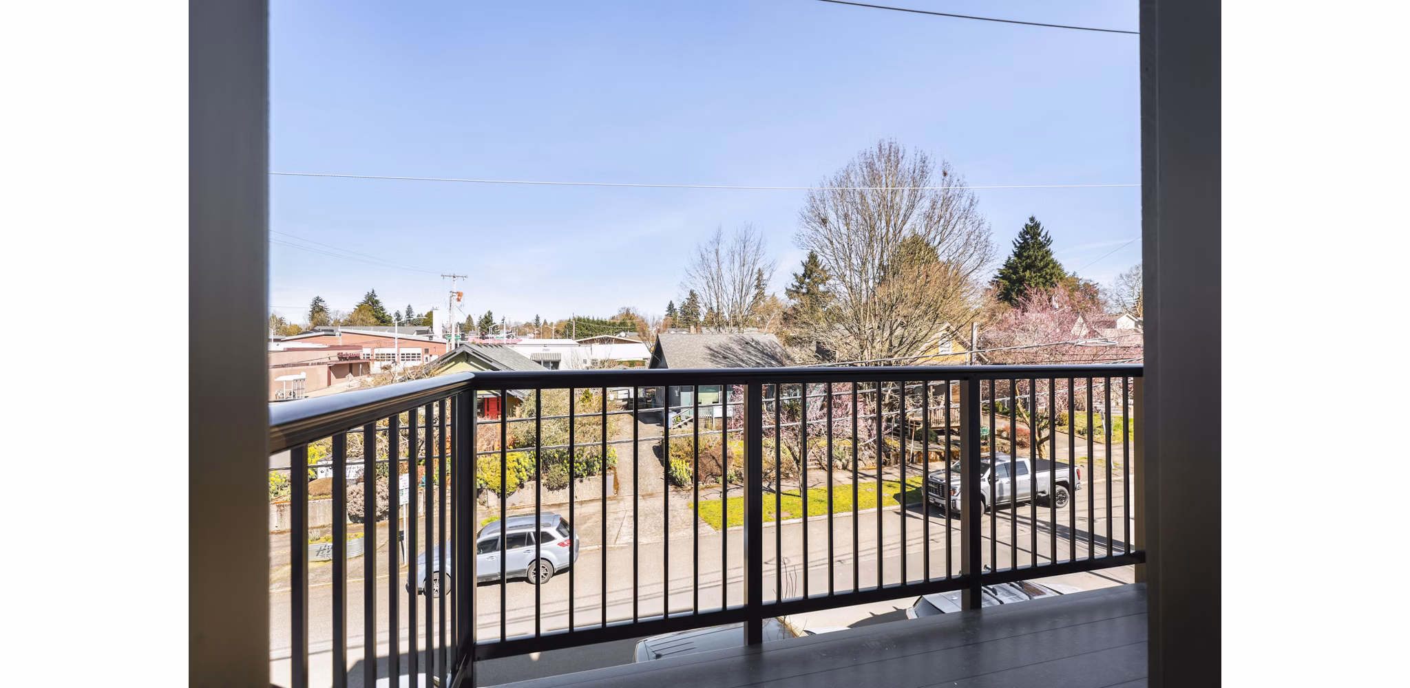 Hudson West Apartments: Contemporary patio space with modern seating and greenery, perfect for relaxation and gatherings