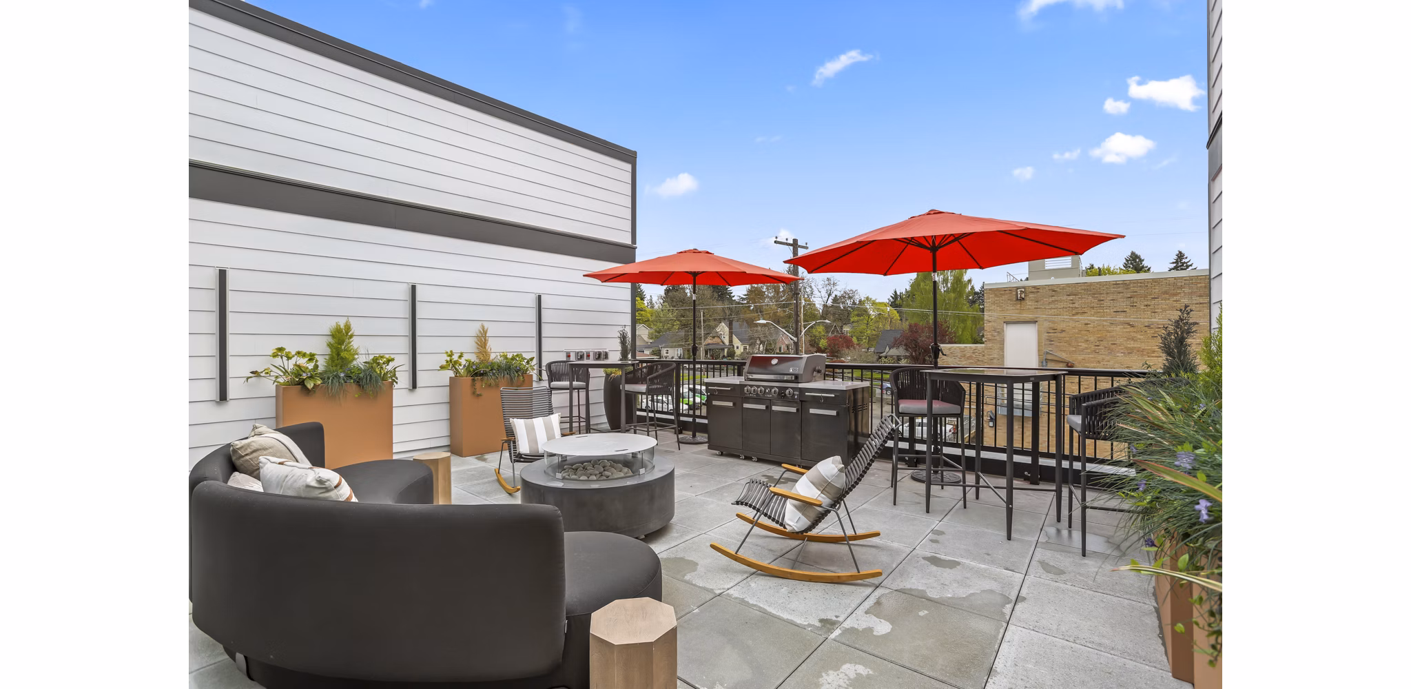 Scenic views from a stylish rooftop deck at Hudson West Apartments, perfect for relaxation and entertainment