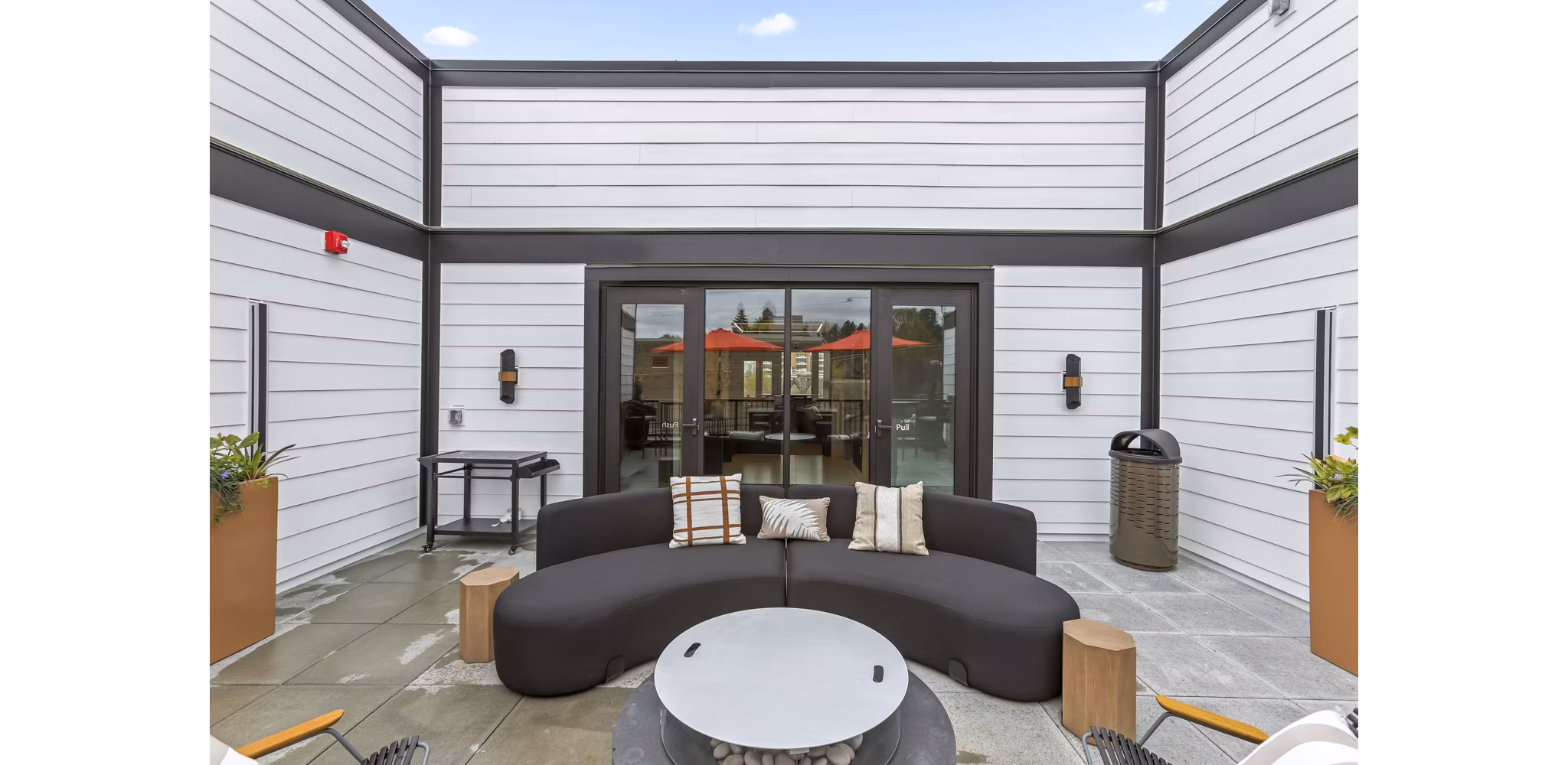 Rooftop deck with city skyline views at Hudson West Apartments