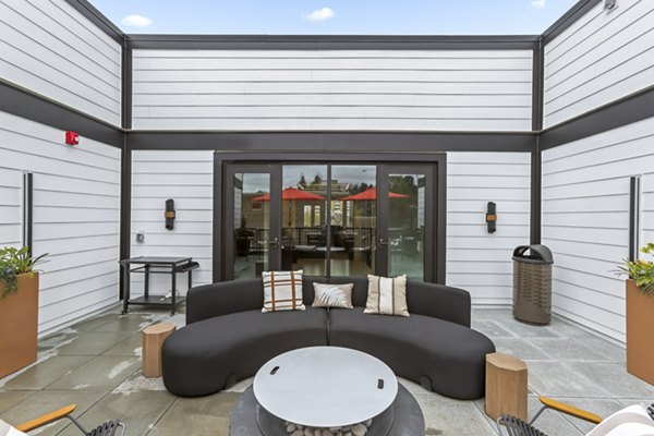 Rooftop deck with city skyline views at Hudson West Apartments