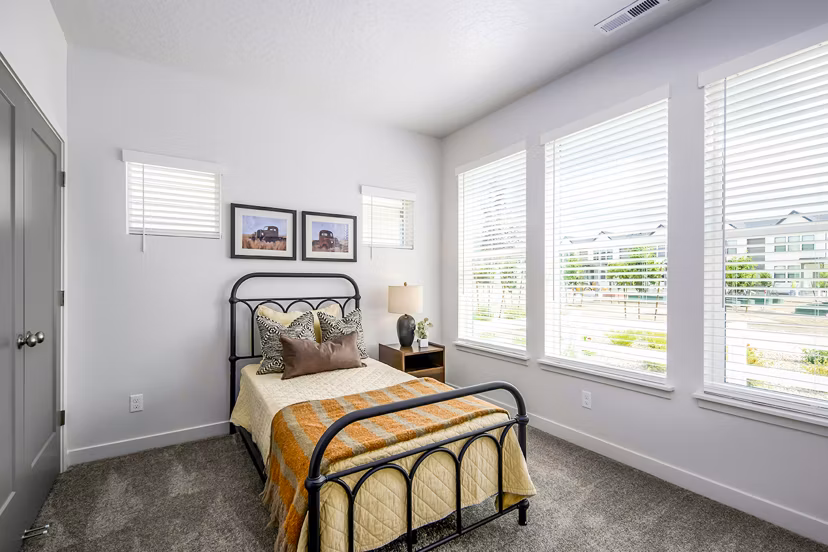 Modern bedroom with cozy decor in Calypso Apartments