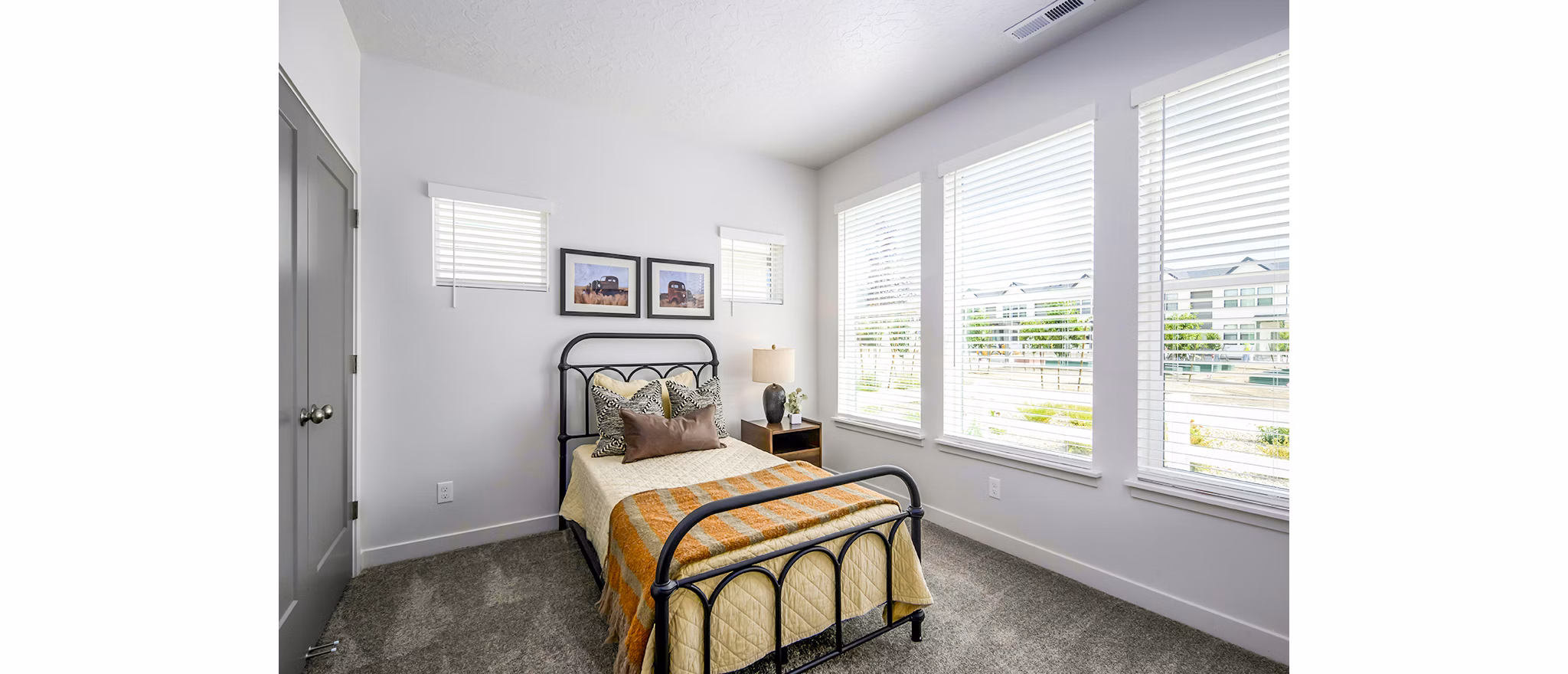 Modern bedroom with cozy decor in Calypso Apartments