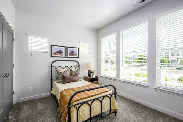 Modern bedroom with cozy decor in Calypso Apartments