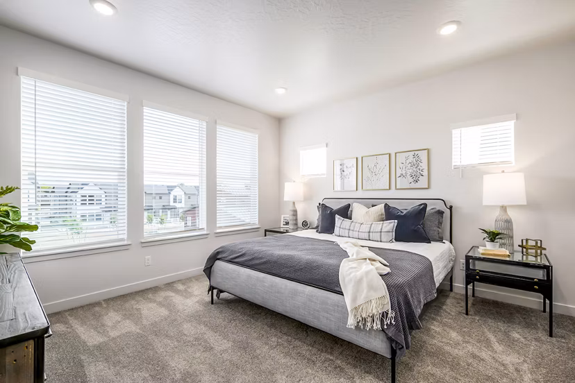 Modern bedroom with ocean-inspired decor at Calypso Apartments