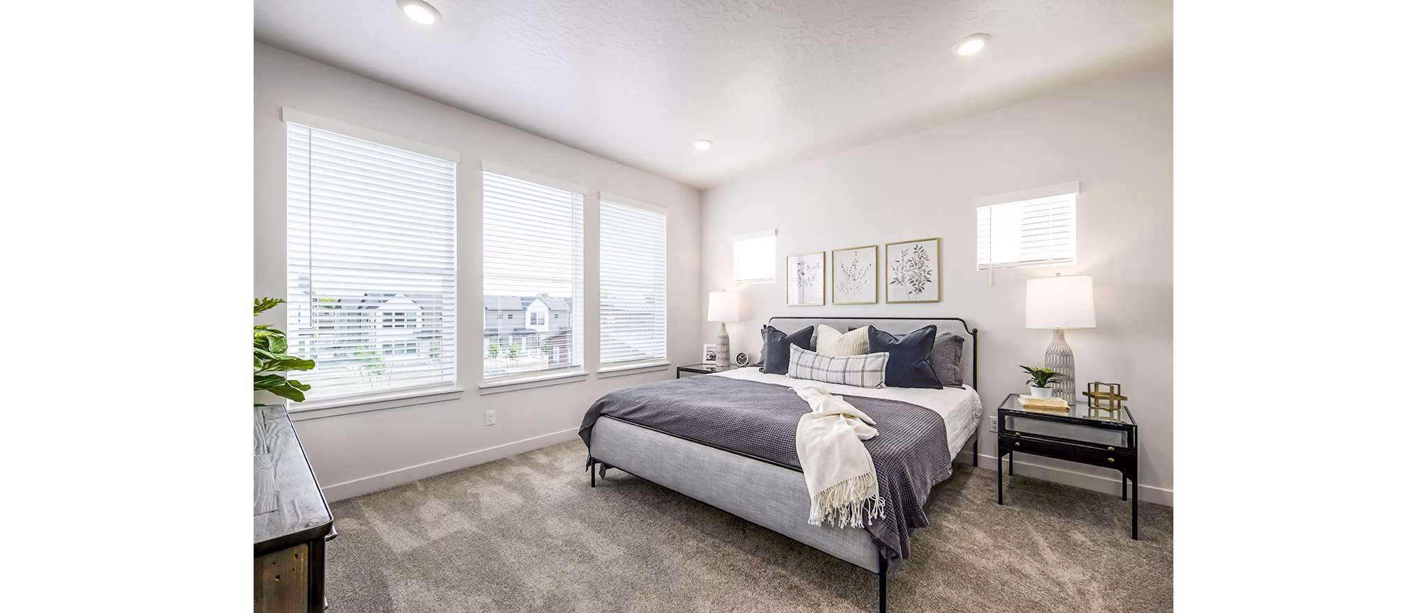 Modern bedroom with ocean-inspired decor at Calypso Apartments