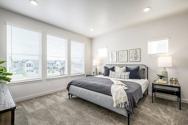 Modern bedroom with ocean-inspired decor at Calypso Apartments