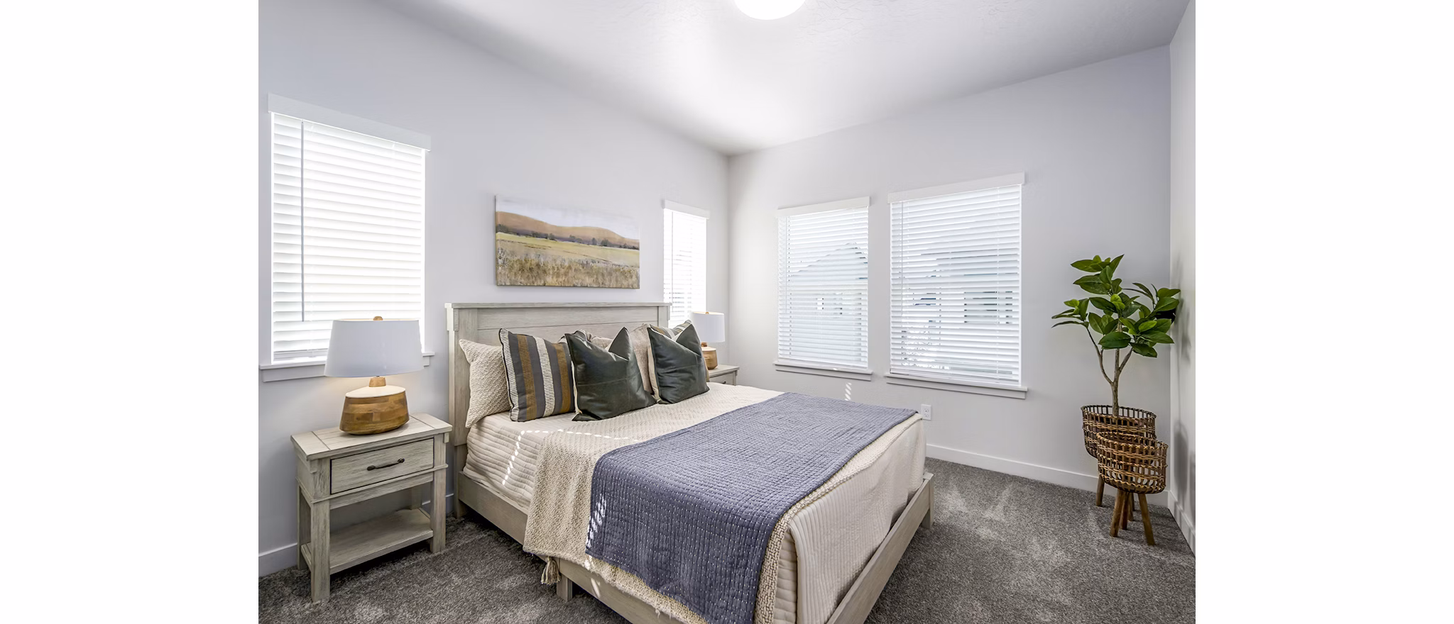 Cozy bedroom with designer accents at Calypso Apartments luxury apartments