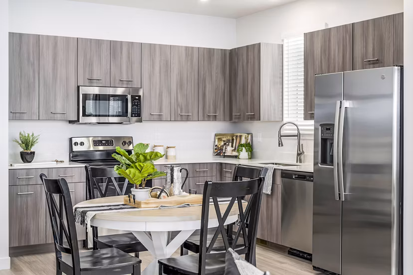 Dining room featuring modern decor and elegant lighting at Calypso Apartments