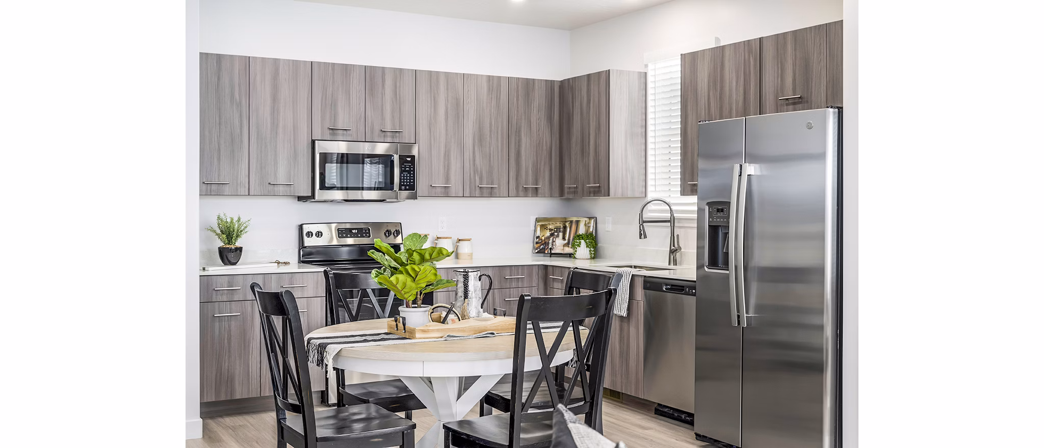 Dining room featuring modern decor and elegant lighting at Calypso Apartments