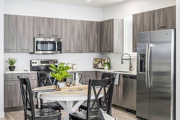 Dining room featuring modern decor and elegant lighting at Calypso Apartments
