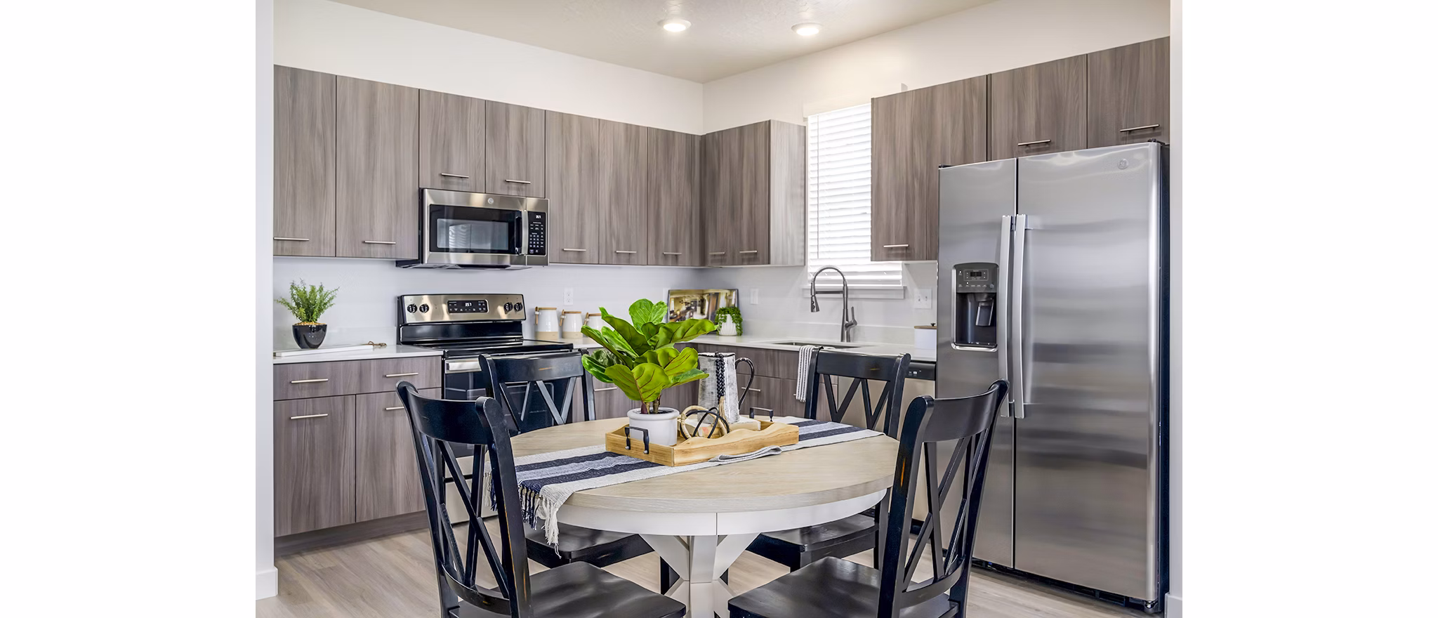 Dining room with elegant decor and modern finishes at Calypso Apartments, an example of luxury living by Greystar