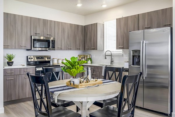 Dining room with elegant decor and modern finishes at Calypso Apartments, an example of luxury living by Greystar