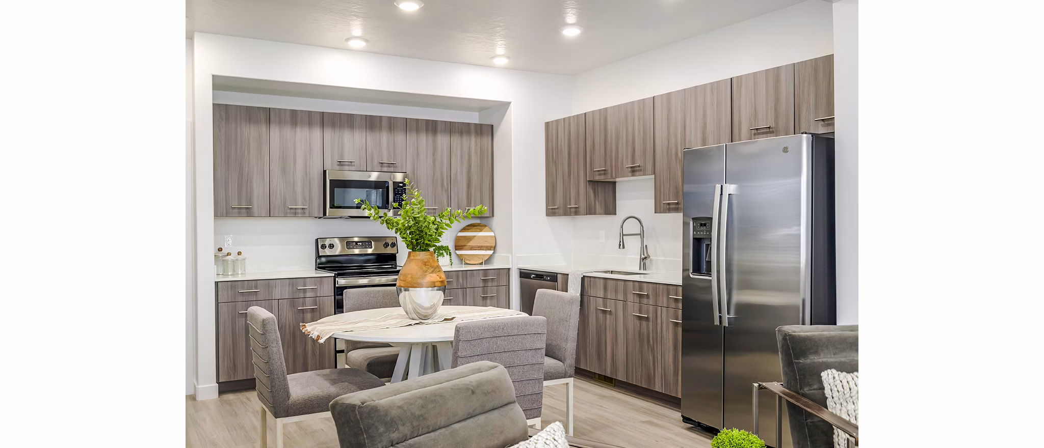 Spacious dining room with modern decor at Calypso Apartments in a luxury setting