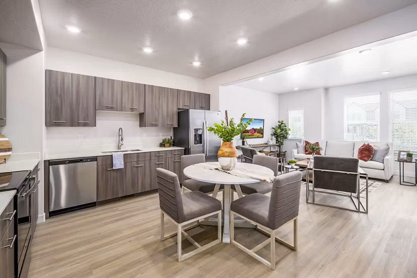 Dining room featuring elegant furnishings and modern lighting in Calypso Apartments, a luxury property by Greystar