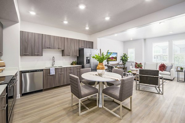 Dining room featuring elegant furnishings and modern lighting in Calypso Apartments, a luxury property by Greystar