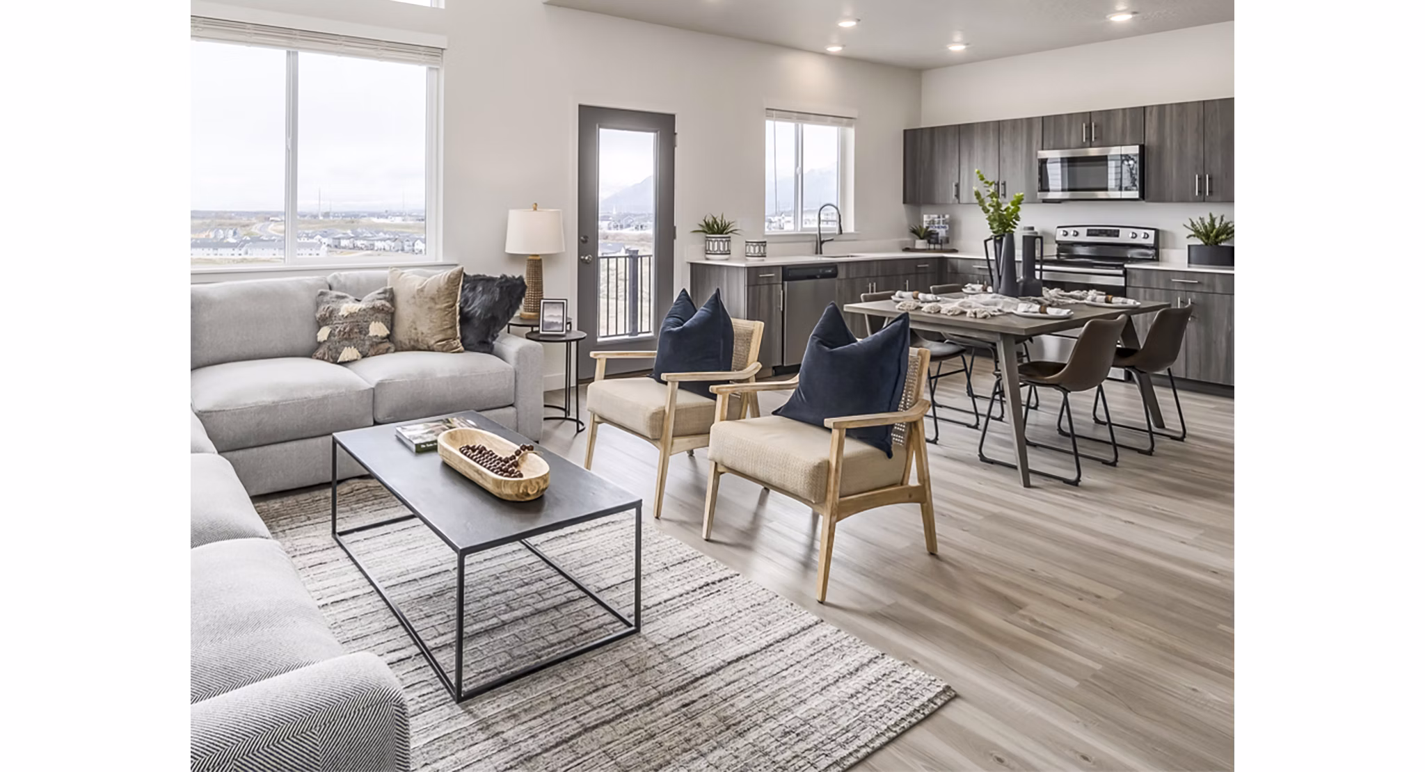 Spacious living room with contemporary design and modern furnishings at Calypso Apartments