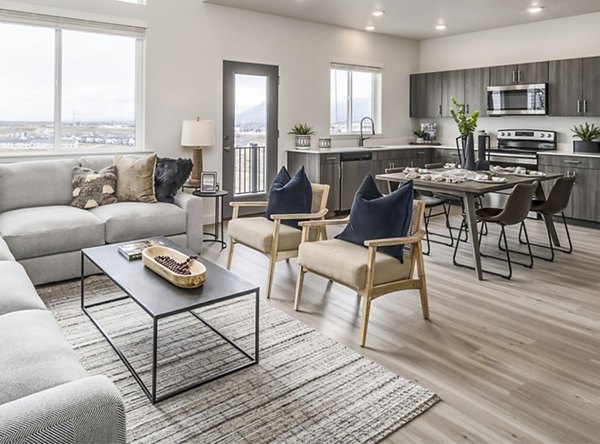 Spacious living room with contemporary design and modern furnishings at Calypso Apartments