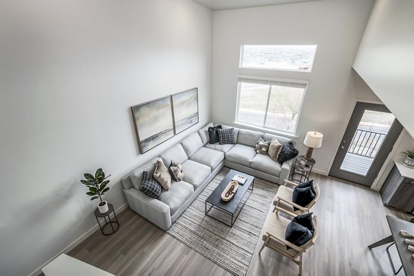 Living room featuring modern furnishings and open layout at Calypso Apartments