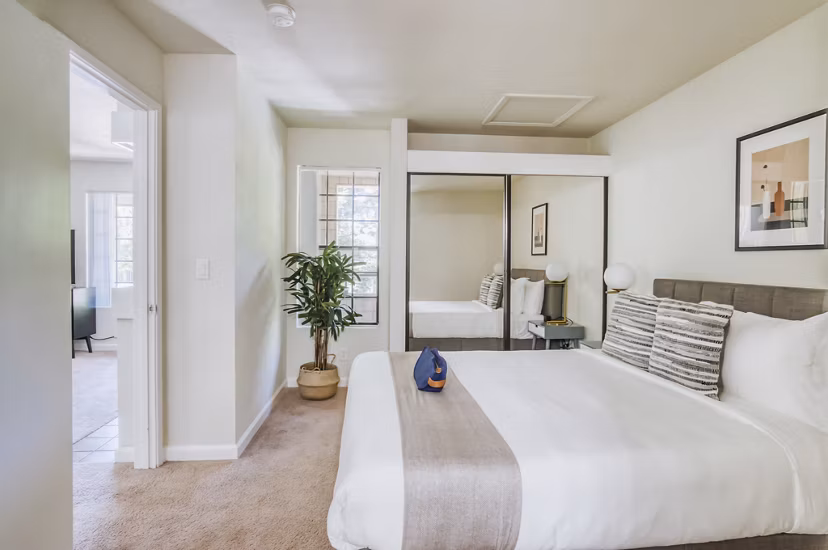 Comfortable bedroom with modern furniture at Ygnacio Village Apartments, ideal for luxury living in a serene setting
