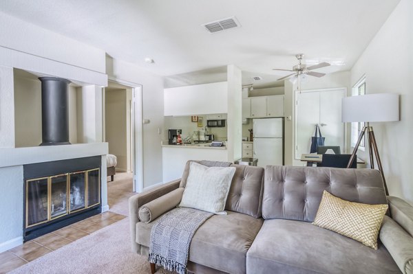 Spacious living room with modern decor and natural lighting in Ygnacio Village Apartments, perfect for luxury living at Greystar community