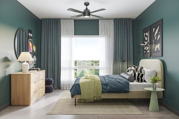 Cozy bedroom with natural light at The Miles Apartments