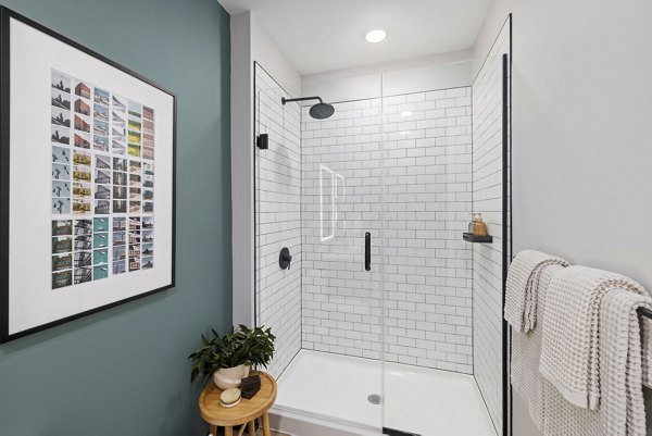 Contemporary bathroom with sleek fixtures and modern design at The Miles Apartments