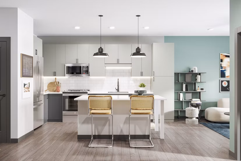 Modern kitchen with stainless steel appliances at The Miles Apartments