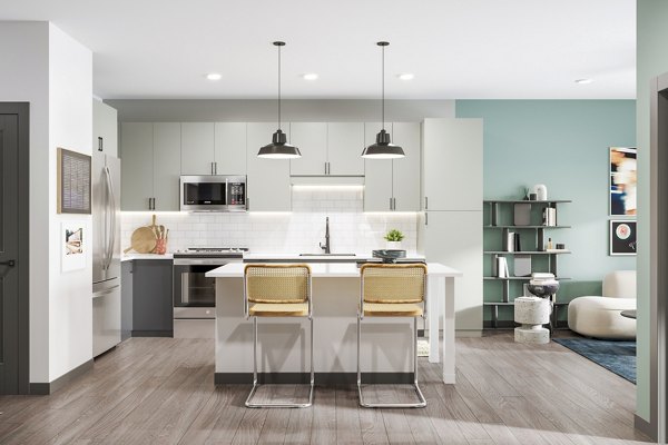 Modern kitchen with stainless steel appliances at The Miles Apartments