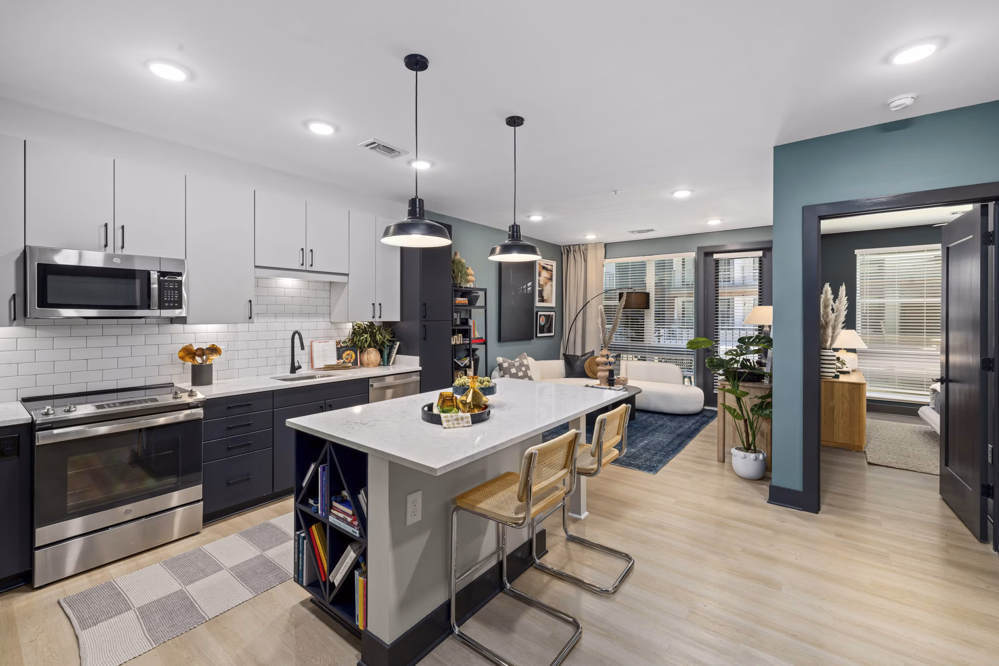 The Miles Apartments: Modern kitchen with stainless steel appliances and sleek countertops in luxury Greystar apartments