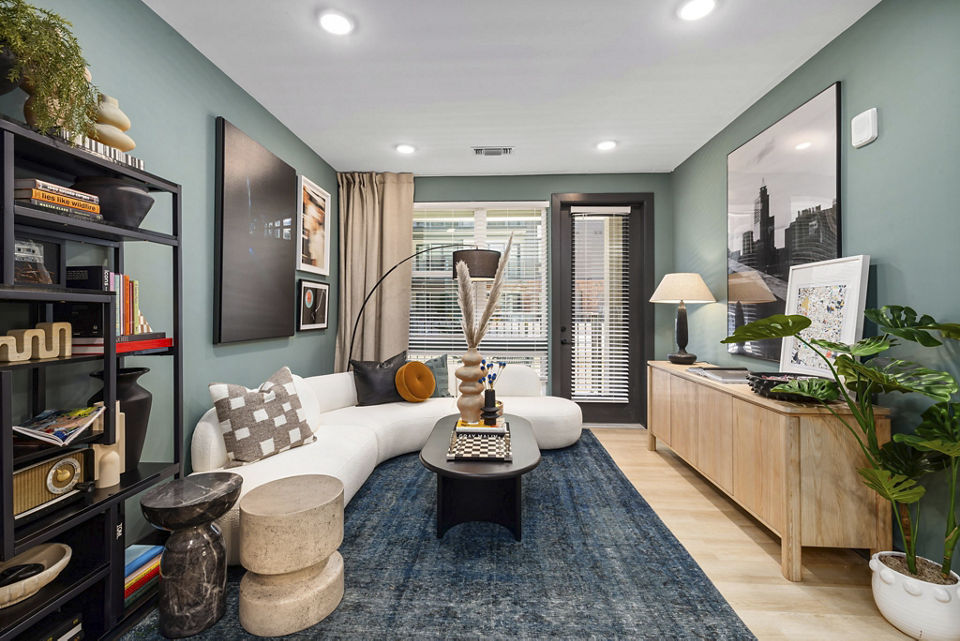 Cozy living room with modern design elements at The Miles Apartments, offering luxurious urban living