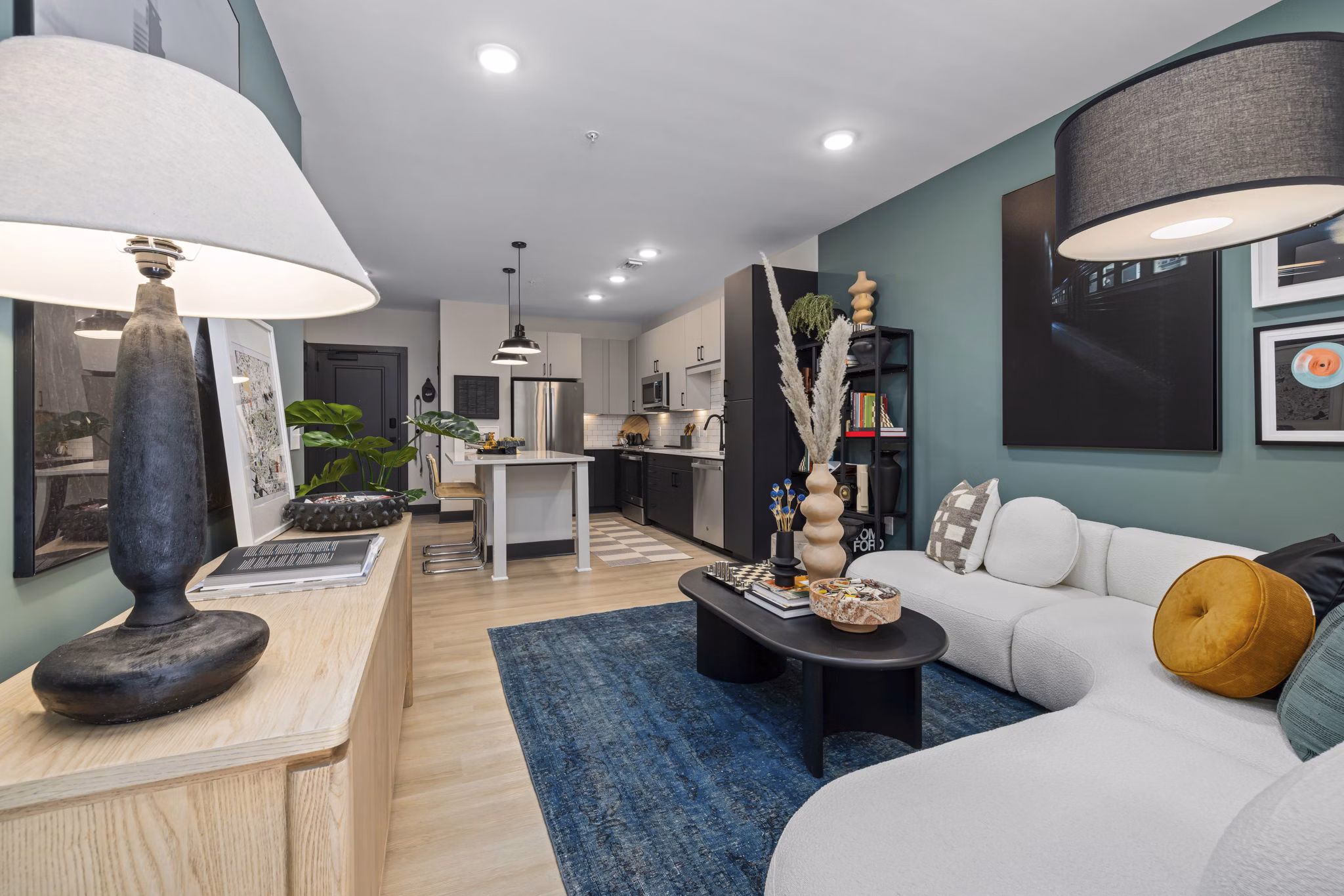 Bright, open-concept living room with modern furnishings at The Miles Apartments