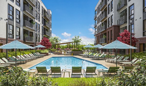 Relaxing poolside view at The Miles Apartments, a luxury community offering resort-style amenities in a tranquil setting