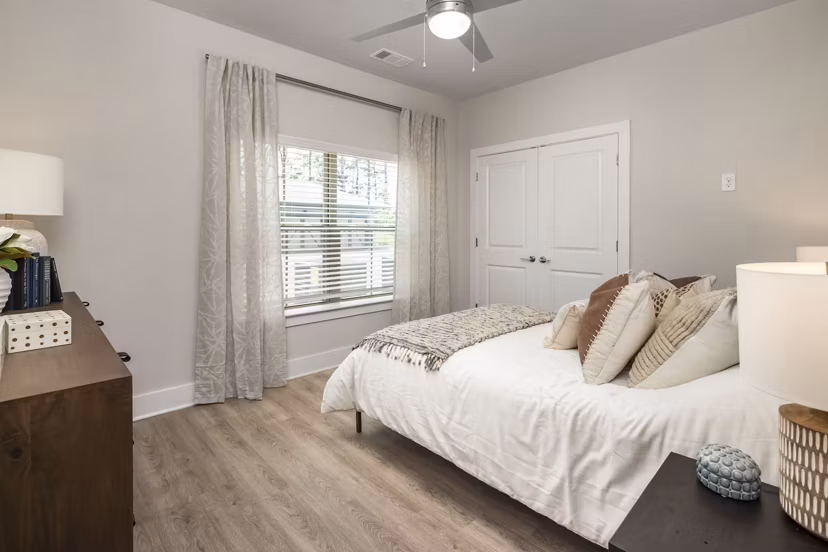 Arcadia at Symphony Park: Modern bedroom with stylish furnishings and large windows in Arcadia luxury apartments, Las Vegas