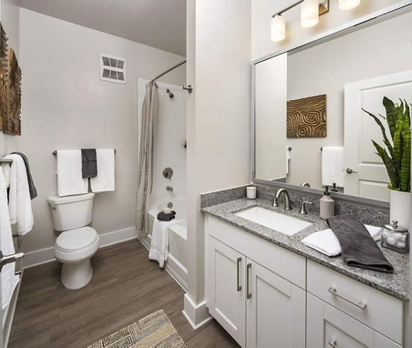 Modern bathroom featuring elegant fixtures at Arcadia at Symphony Park Apartments