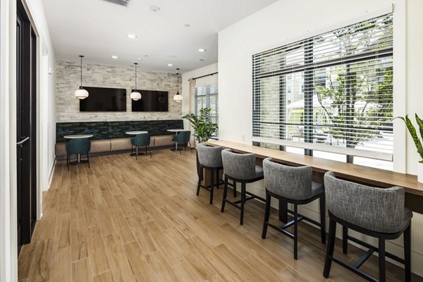 Elegant clubhouse featuring modern dÃ©cor at Arcadia at Symphony Park Apartments, perfect for social and recreational gatherings
