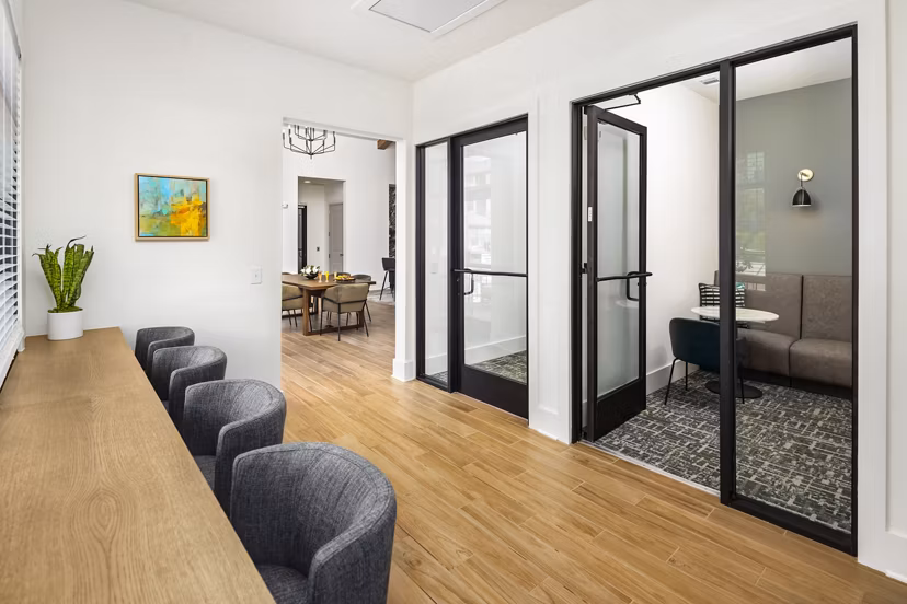 Clubhouse at Arcadia at Symphony Park Apartments: Elegant gathering space featuring modern seating and lighting in a luxury apartment community
