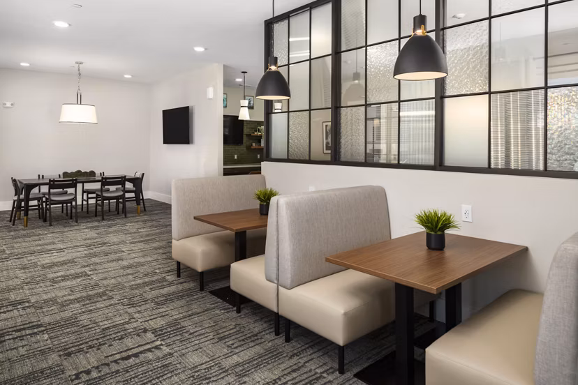 Elegant clubhouse with modern decor at Arcadia at Symphony Park Apartments, ideal for social gatherings and events