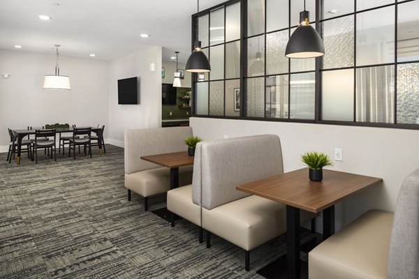 Elegant clubhouse with modern decor at Arcadia at Symphony Park Apartments, ideal for social gatherings and events