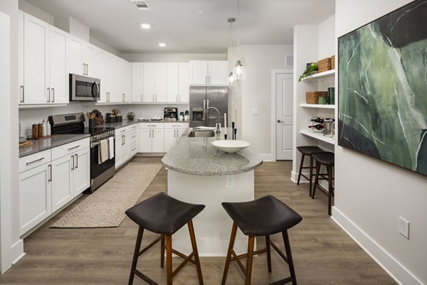 Luxurious kitchen with modern appliances in Arcadia at Symphony Park Apartments, perfect for residents who love to cook and entertain