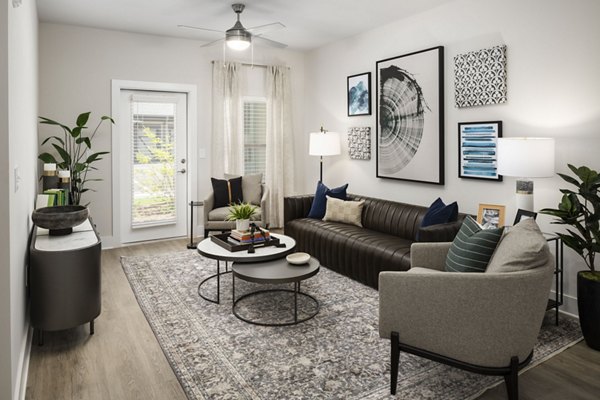 Spacious living room featuring contemporary design and large windows at Arcadia at Symphony Park Apartments