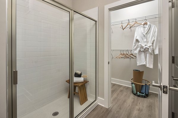 Laundry room featuring modern washer and dryer at Arcadia at Symphony Park Apartments