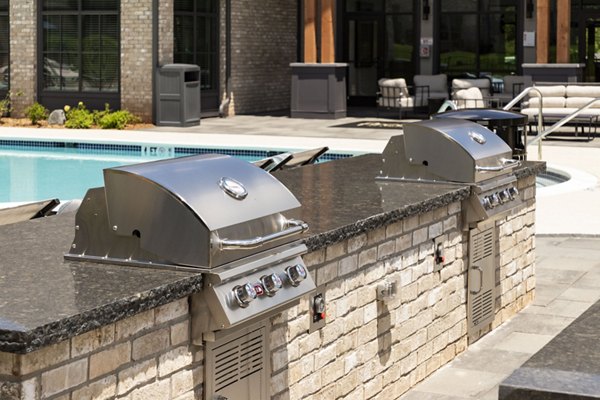 Patio view with modern outdoor furniture at Arcadia at Symphony Park Apartments, perfect for relaxation and social gatherings